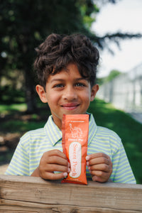 Ramalynn Montessori Academy student enjoying EllyPop outside on playground in Bloomington Minnesota