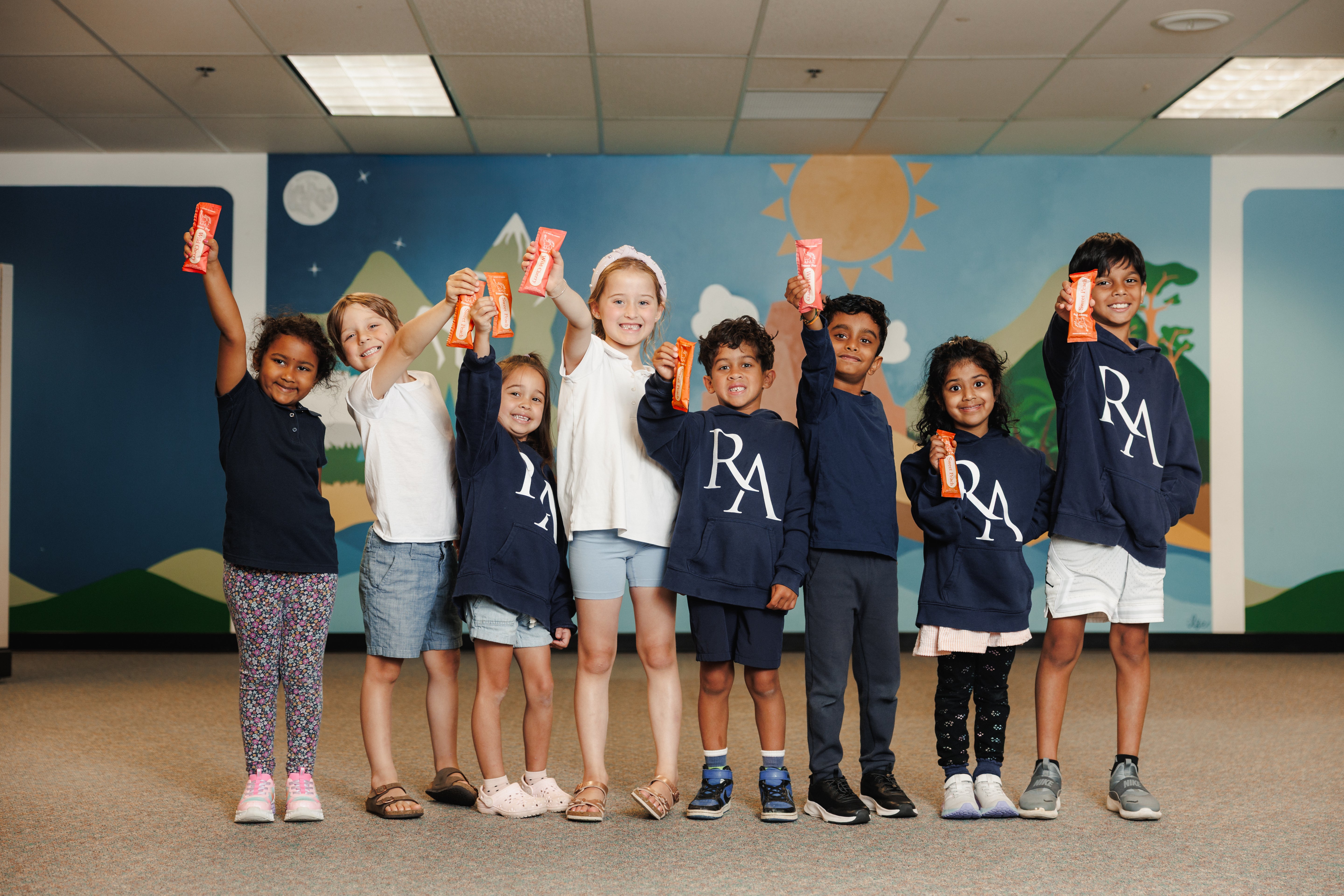 Ramalynn Montessori Academy students holding EllyPop Freezer Pops in Classroom in Bloomington Minnesota