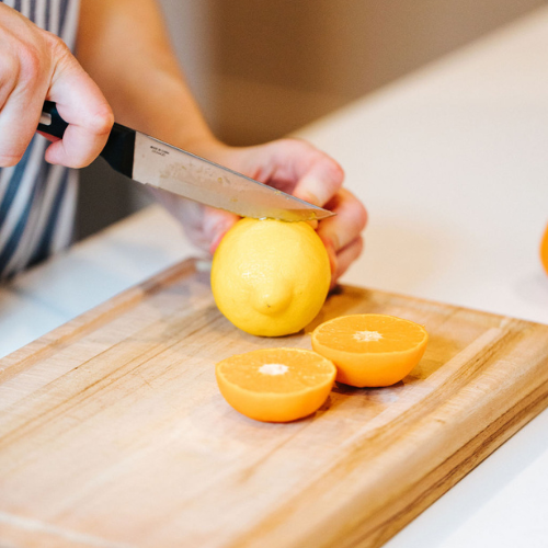 Naturopathic doctor slicing lemons for EllyPop